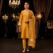 Women's mustard gold embroidered kurta suit set with matching pants and detailed dupatta
