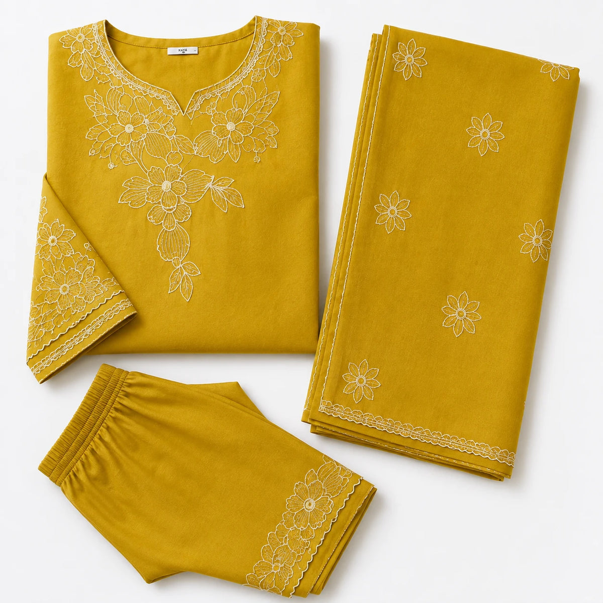 Woman wearing a mustard yellow floral embroidered kurta pant set with matching dupatta