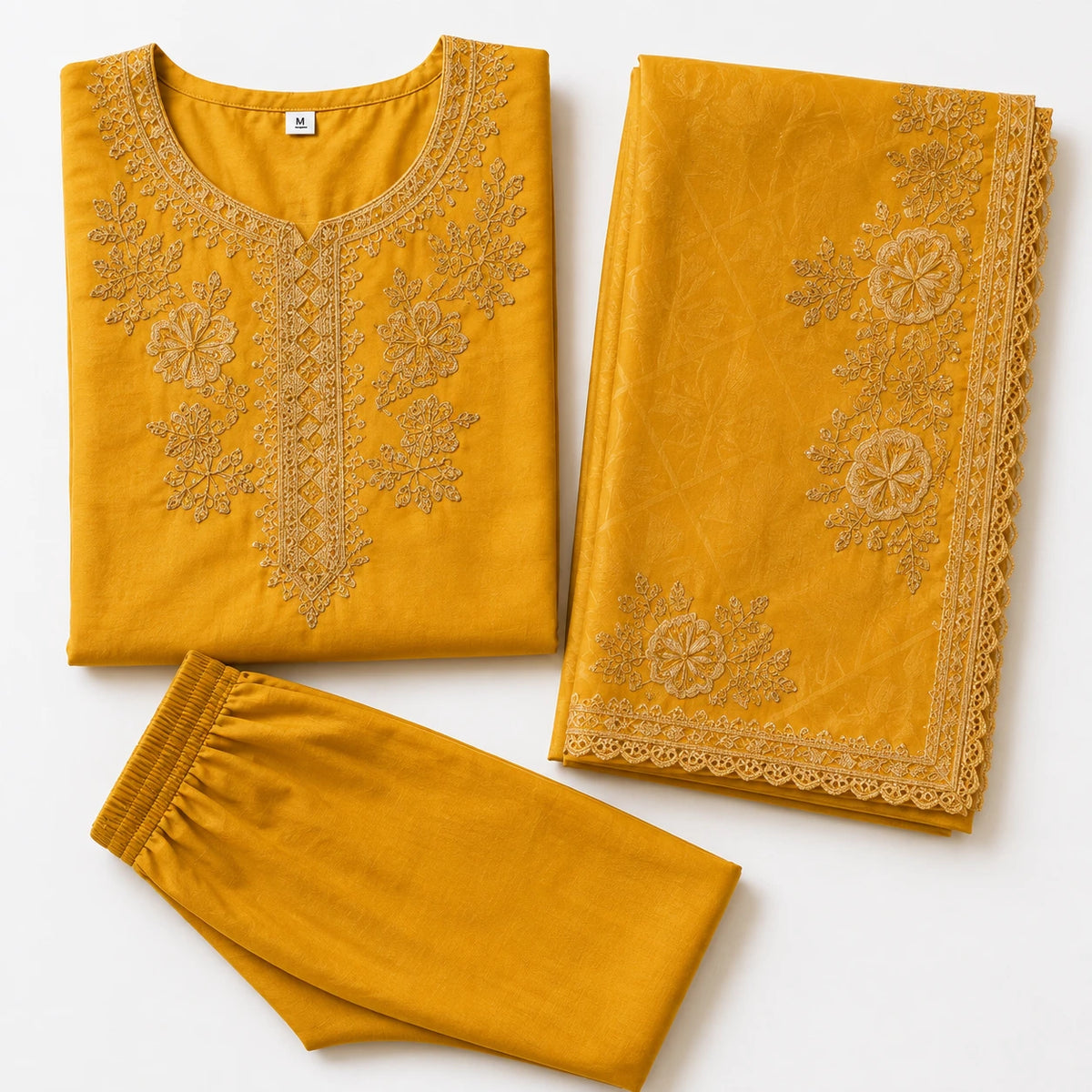 Woman wearing a golden mustard embroidered kurta pant set with a lace-trimmed dupatta