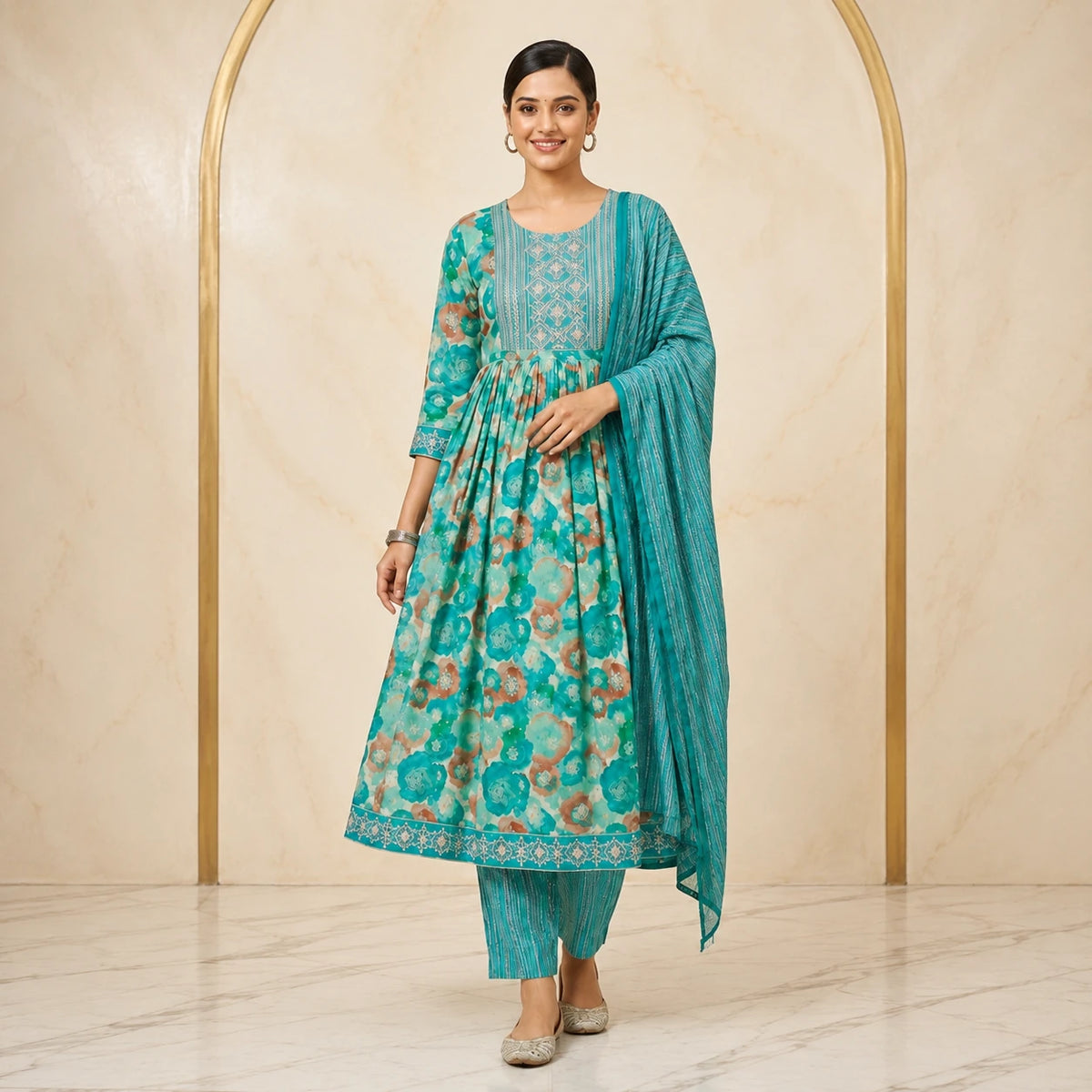 Woman wearing teal turquoise floral printed Anarkali kurta pant set with striped dupatta
