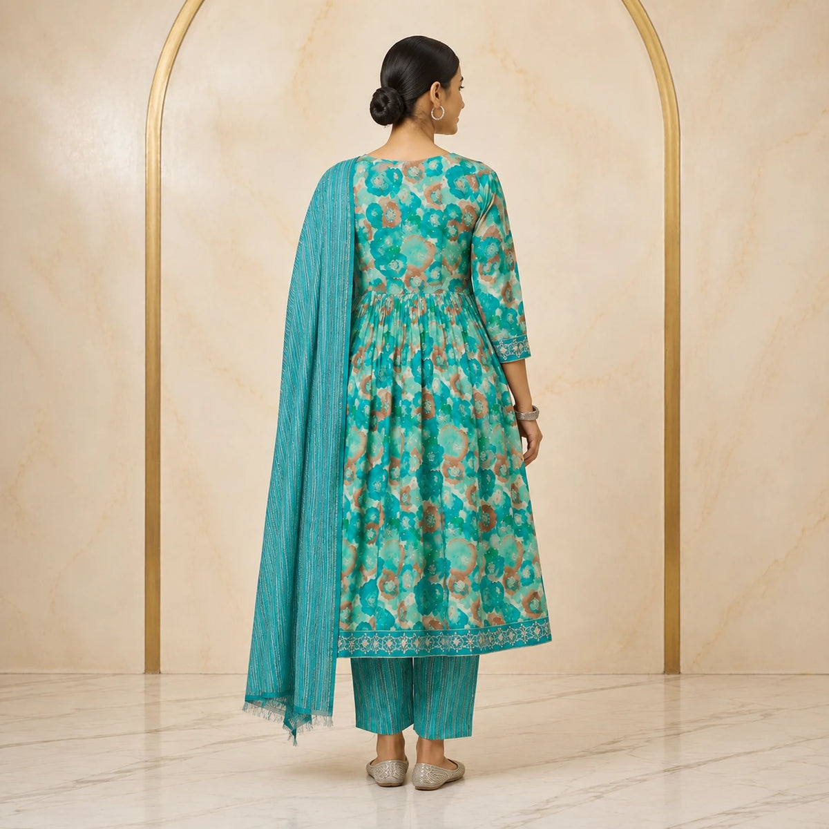 Woman wearing teal turquoise floral printed Anarkali kurta pant set with striped dupatta