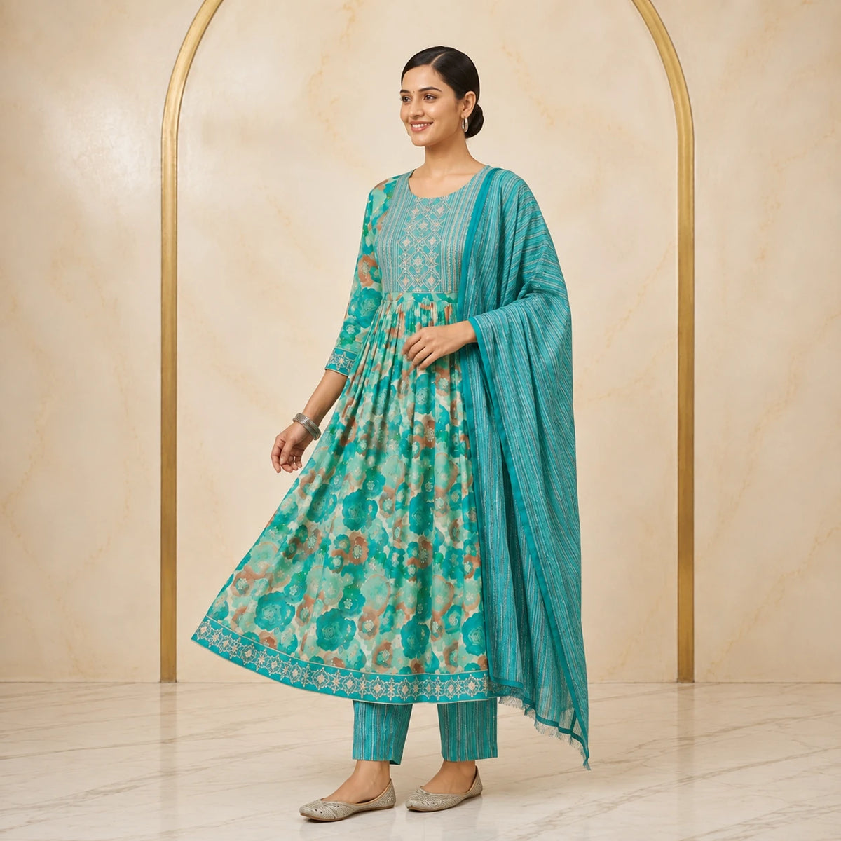 Woman wearing teal turquoise floral printed Anarkali kurta pant set with striped dupatta